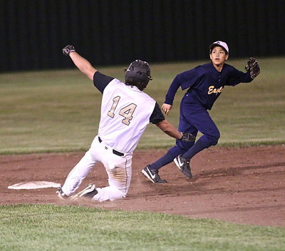 Image: Kyle Fortenberry(14) slides safely into second-base.