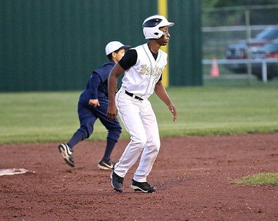 Image: Senior Gladiator Eric Carson(2) looks for a chance to steal third, which he does with ease.