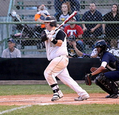 Image: John Byers(18), one of the top hitters in the district, connects on a pitch.