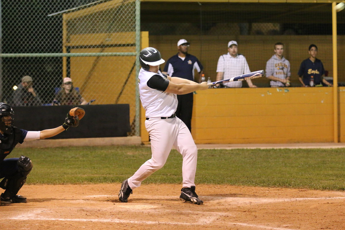 Image: Zain Byers(5) lofts a shot into deep center but the Eagles make a snow cone catch to foil the attempt.