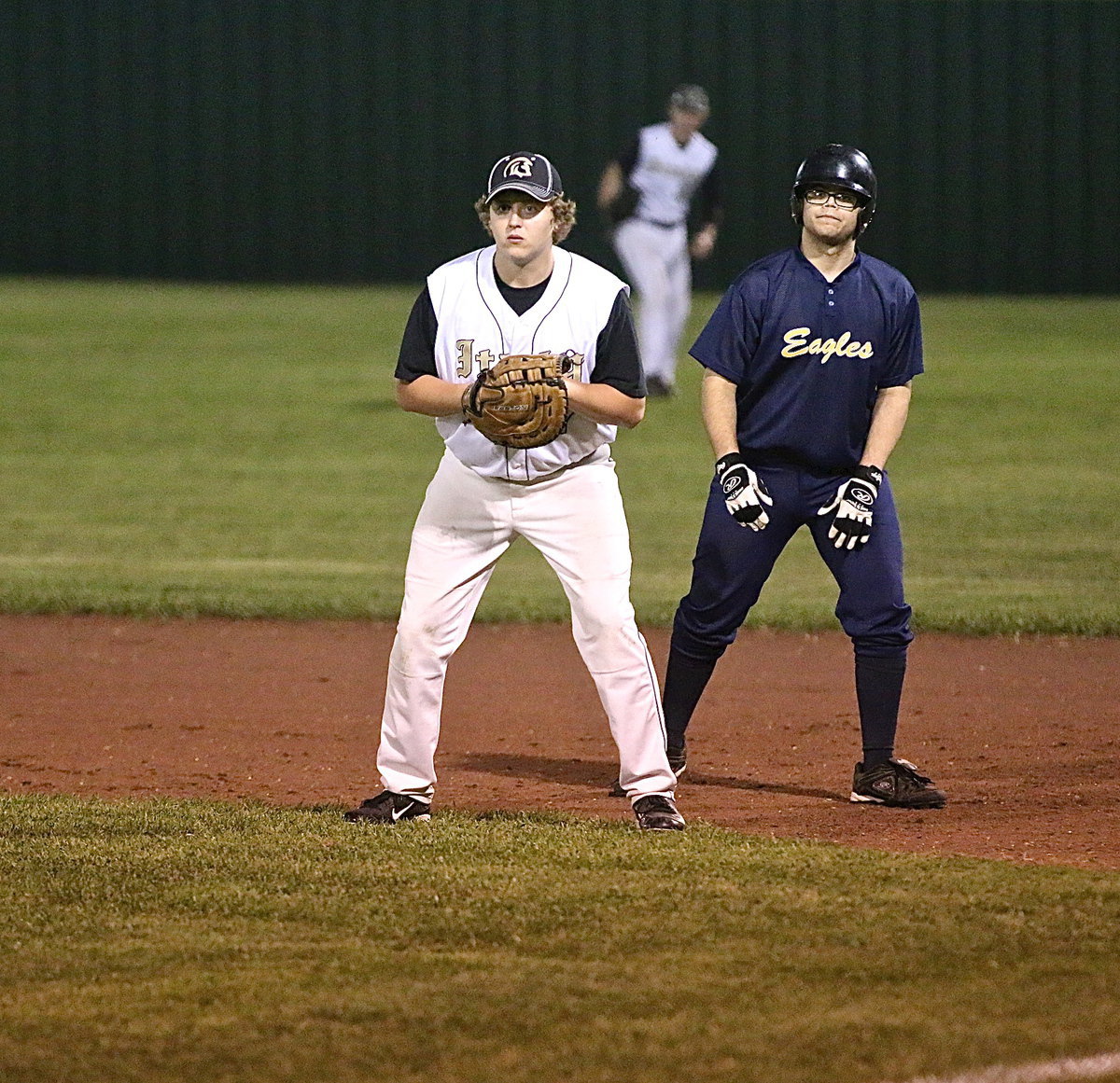 Image: Senior Gladiator first-baseman Bailey Walton(17) helps keeps the Eagle offense grounded.