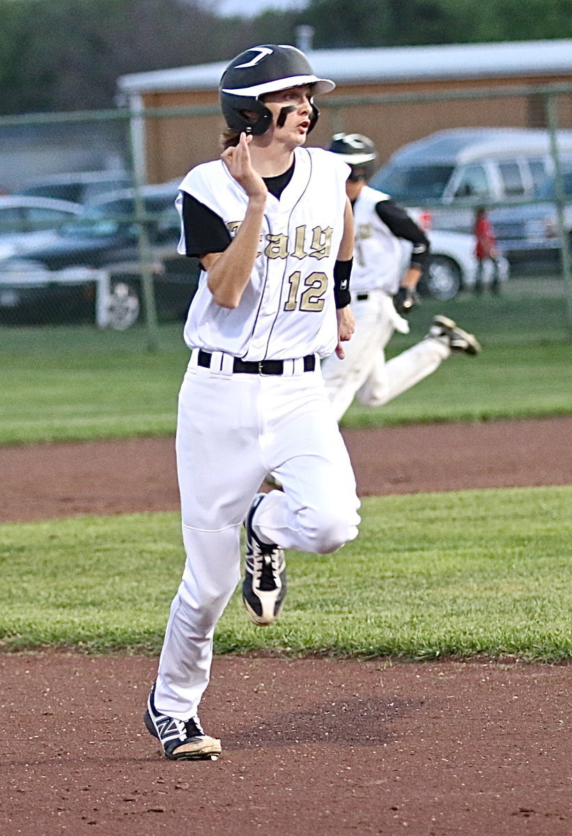 Image: Ty “Windsprint” Windham(12) and teammate Levi McBride(1) round the bases.