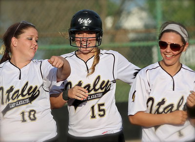 Image: Jaclynn Lewis(15) celebrates her out-of-the-park homer with Lady Gladiator teammates Paige Westbrook(10) and Bailey Eubank(1).
