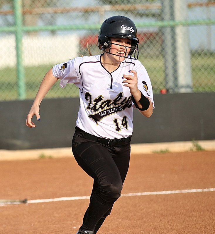Image: Oh the determination as Kelsey Nelson(14) races to first-base!