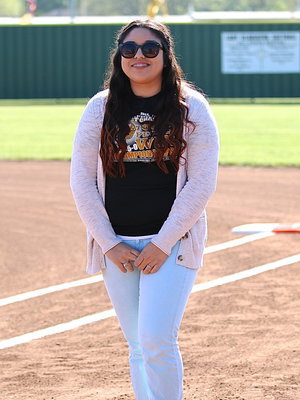 Image: Lady Gladiator senior scorekeeper/music producer, Monserrat Figueroa is honored before their start of the final home game between Italy and Avalon.