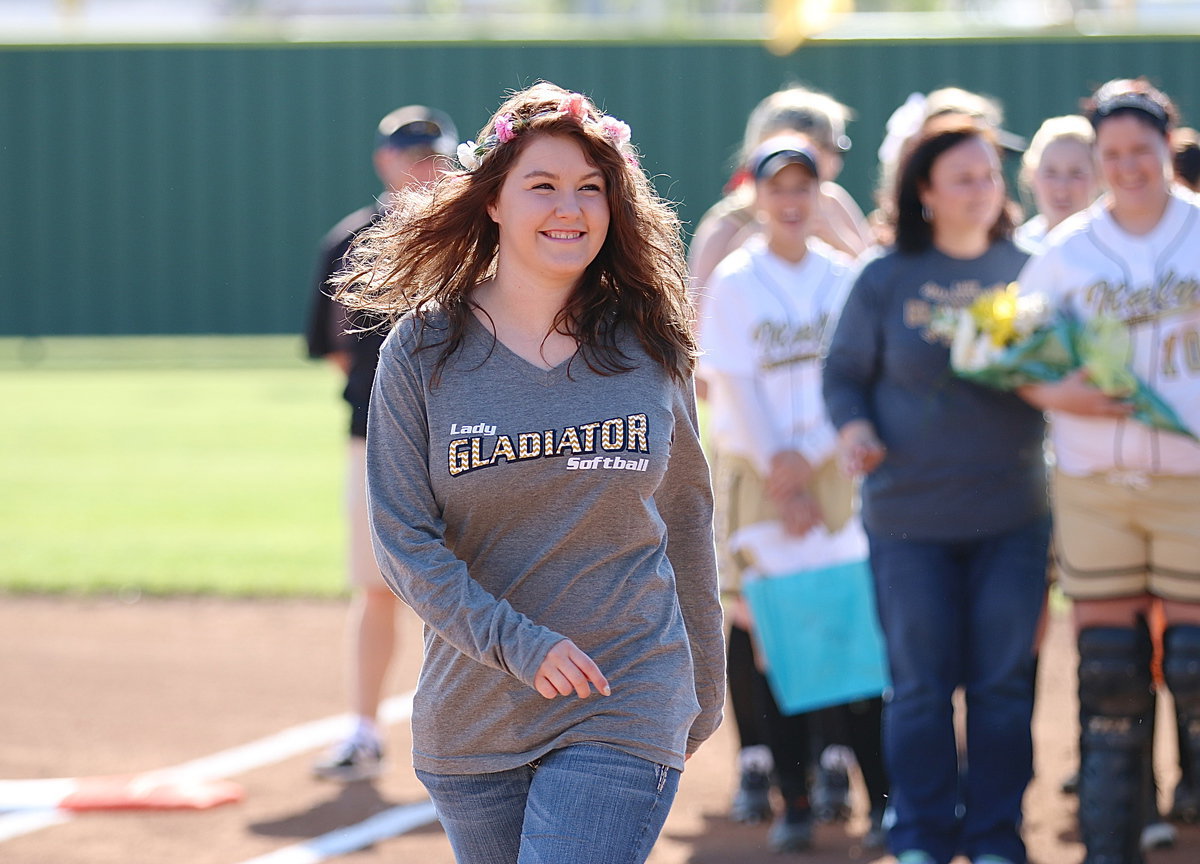 Image: Lady Gladiator senior bookkeeper Taylor Turner is honored before their start of the final home game between Italy and Avalon.