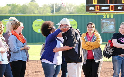 Image: Marquisha Burkhalter-Jeng offers Coach Jones a congratulatory hug.
