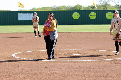 Image: Current Lady Gladiators Madison Washington and Jaclynn Lewis support Tessa Tovar South, who was the first Lady Gladiator softball pitcher to take the mound back in 1998. South threw out the ceremonial first pitch as part of the field dedication ceremonies for her former head coach Johnny Jones.