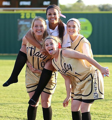 Image: Lady Gladiators Hannah Washington, Ashlyn Jacinto, Cassidy Childers and Britney Chambers celebrate their district win over Avalon.