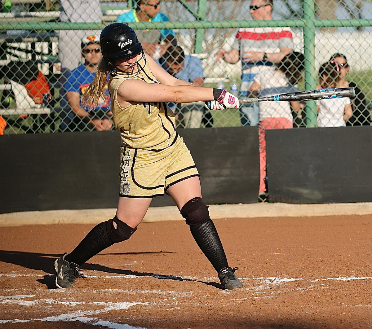 Image: Jaclynn Lewis(15) goes bang as she just misses clearing the centerfield fence with a walk-off triple. Lewis recorded two RBIs on the play to score teammates Bailey Eubank and Amber Hooker and end the game via run rule, 15-0.