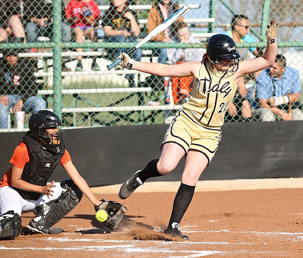 Image: Madison Washington(22) tries to avoid a wild pitch but is granted first-base.