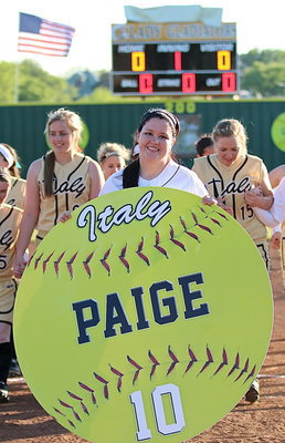Image: Paige Westbrook(10) completes her Senior Walk followed by her teammates. Paige displays her personalized sign that is hers to keep.