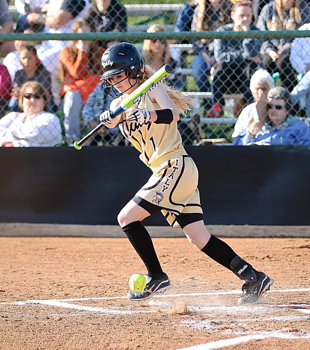 Image: Britney Chambers(1) slaps the ball into play and then hurries to first-base.