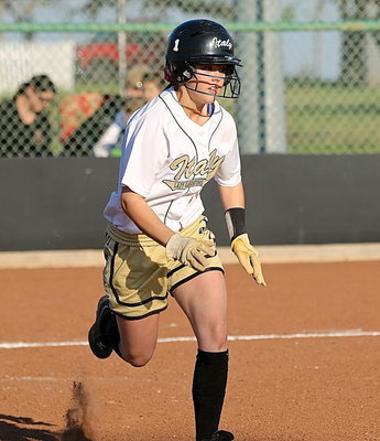 Image: There she goes! Bailey Eubank(43) hustles down to first-base.