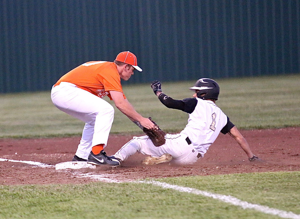 Image: Italy’s Levi McBride(1) beats the throw to third-base.