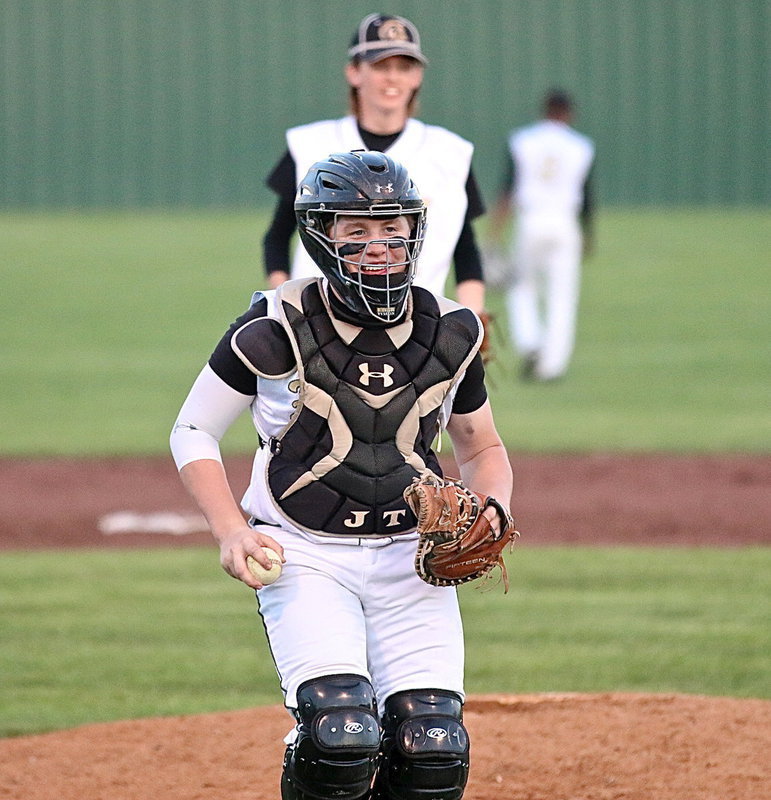 Image: Junior catcher John Escamilla(7) keeps his pitcher Ty Windham(12) loose on the mound.