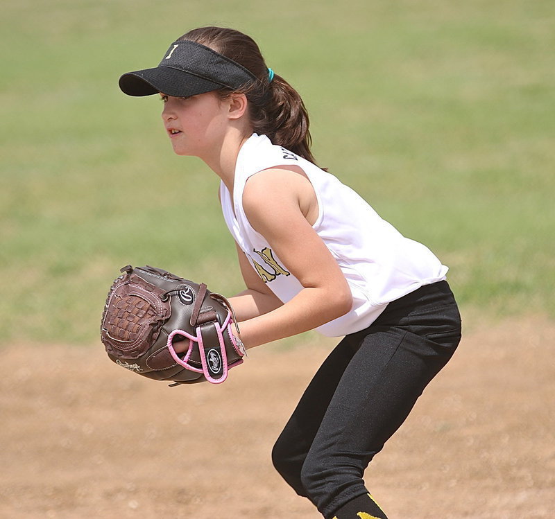 Image: Paige Butler makes the catch for an out at first-base.