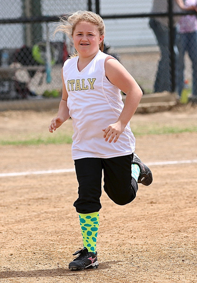 Image: Haley Mathers hustles off the field after the game.