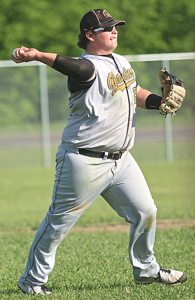 Image: Gladiator third-baseman John Byers(21) makes another play on a ground ball and then throws to teammate Kevin Roldan at first-base for the out.