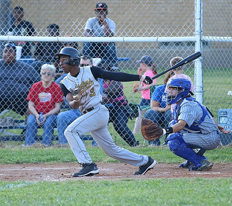 Image: Senior Gladiator Eric Carson(3) swings away on a Bulldog pitch. Carson has a single and 2RBIs during the district standoff.