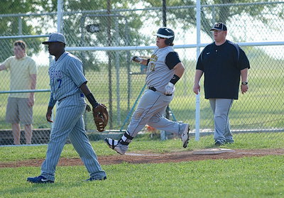 Image: Junior John Byers(21) singles for the Gladiators. Byers is the current district leader for home runs with two.