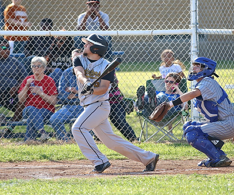 Image: Senior Gladiator Tyler Anderson(9) keeps the hits coming against Milford.