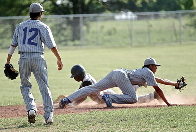 Image: MIlford’s Devonteh Williams makes the grab but Italy’s Eric Carson(3) still manages to steal second as Bulldog shortstop Daren Cisneros(12) looks on.