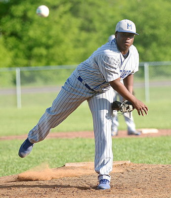 Image: Jacarvus Gates(7) takes over at pitcher for the Bulldogs.