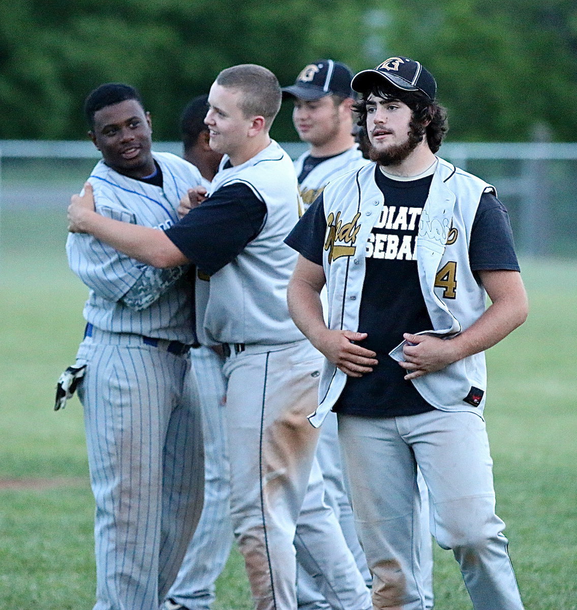 Image: Former pee-wee teammates and friends, Italy and Milford’s players have enjoyed competing against one another this season with both towns back in the same district. Here Italy’s Bailey Walton(13), Kyle Fortenberry(14) and Zain Byers(20) congratulate Milford’s Jacarvus Gates(7) and his teammates.