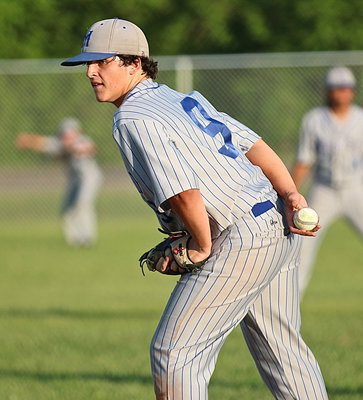 Image: Milford’s Tyler Fedrick(9) enters the game as the third Bulldog to take the mound against the Gladiators.