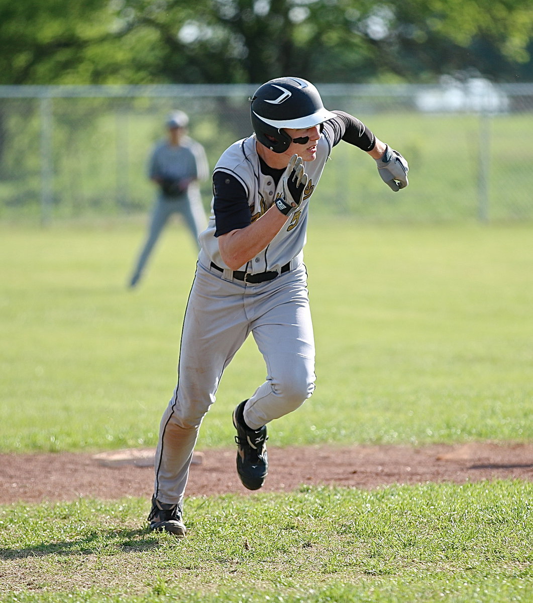 Image: Gladiator Cody Boyd(5) motors his way to third-base.