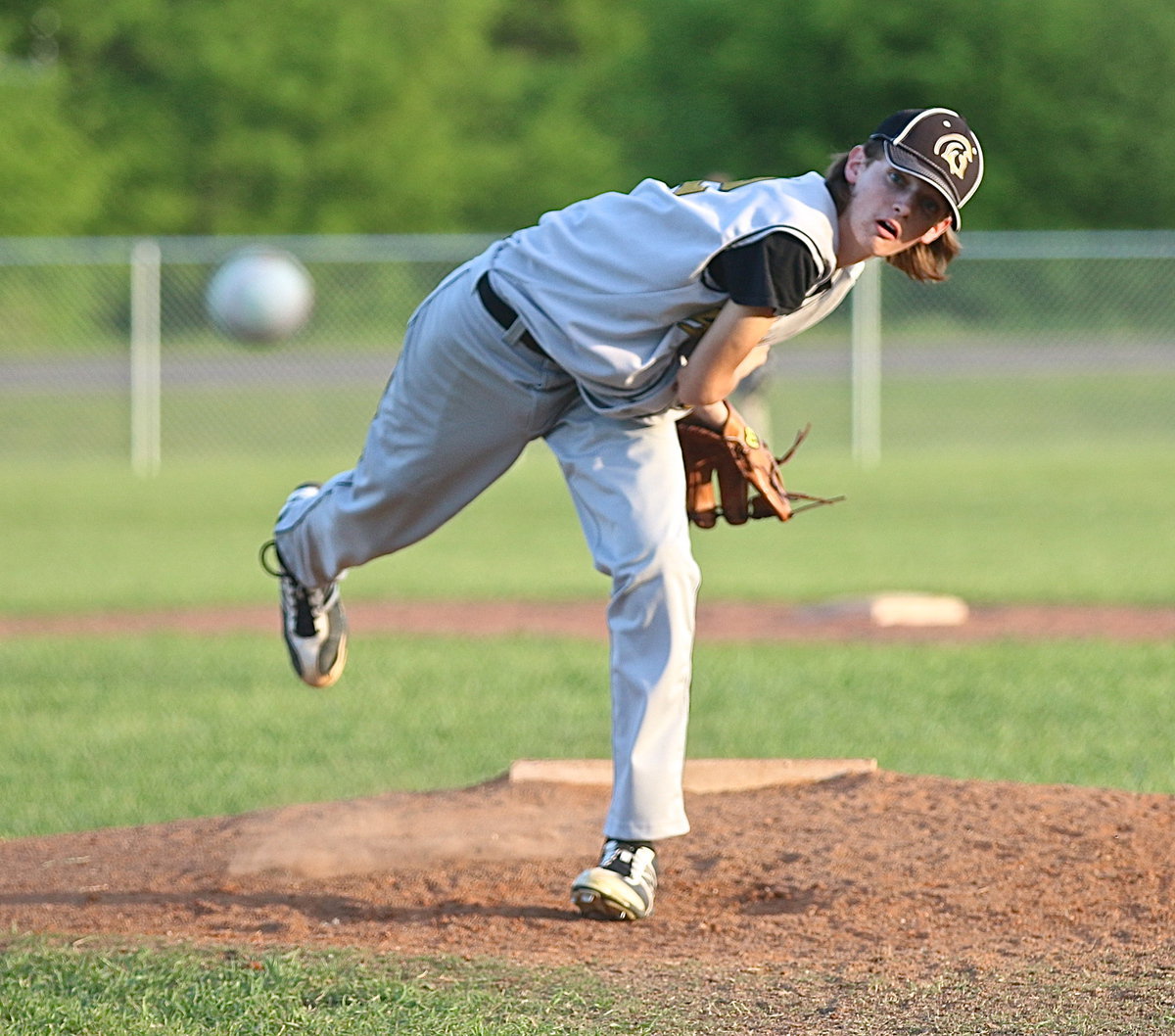 Image: Sophomore pitcher Ty Windham(12) brings the heat in an effort to close out the win for the Gladiators.