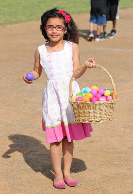 Image: With a colorful basket of Easter eggs.