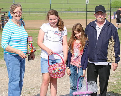 Image: Linda and John Goodman of Italy enjoy the Easter egg hunt with their grandkids.