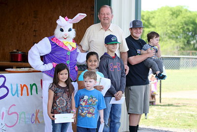 Image: City of Italy Mayor James Hobbs gets help from the Easter Bunny, Breyanna Beets, and from Gladiator Baseball star Tyler Vencill to help congratulate the prize winners who found the money eggs!