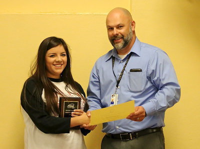 Image: FCCLA member Adriana Celis is presented a plaque and a certificate by Italy ISD Principal Lee Joffre for her 6th place finish at the state level among big and little schools as an Environmental Ambassador.