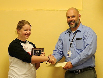 Image: FCCLA member Tia Russell is presented a plaque and a certificate by Italy ISD Principal Lee Joffre for his 4th place finish at the state level among big and little schools for Presentation and Sports Nutrition.