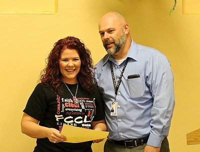 Image: Jennifer Eaglen is presented a certificate of dedication for her efforts in advancing six FCCLA students to the state competition in just her first year overseeing the program.