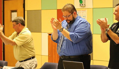 Image: Italy ISD Superintendent Jamie Velasco (middle) is joined Larry Eubank, Paul Cockerham and the rest of the school board in congratulating band directors Jesus Perez and Davis Graves.