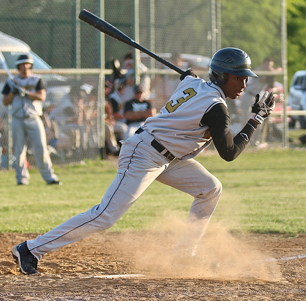 Image: The speed of Eric Carson(3) turns a short hit into a single.