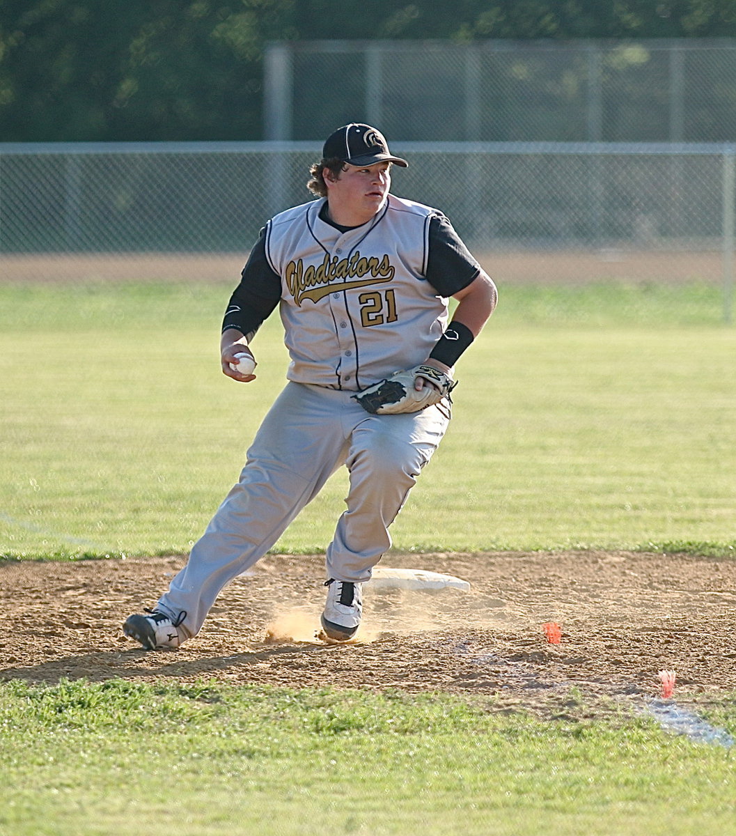 Image: John Byers(21) covers a grounder hit down the third-base line and then throws across the infield to get a Wampus Cat runner out.