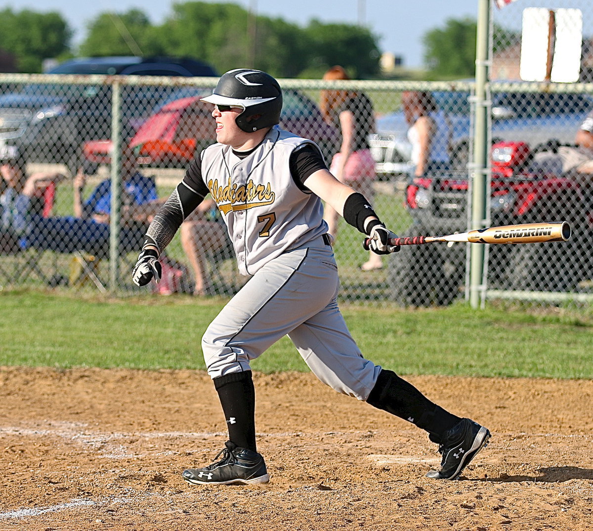 Image: John Escamilla(7) pelts one into play for the Gladiators.