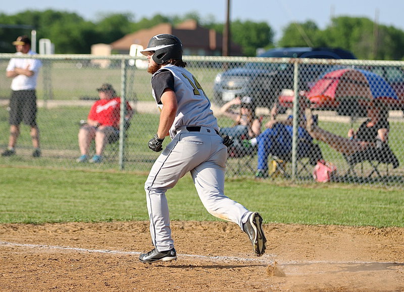 Image: Kyle Fortenbery(14) hits and then pushes to first-base.