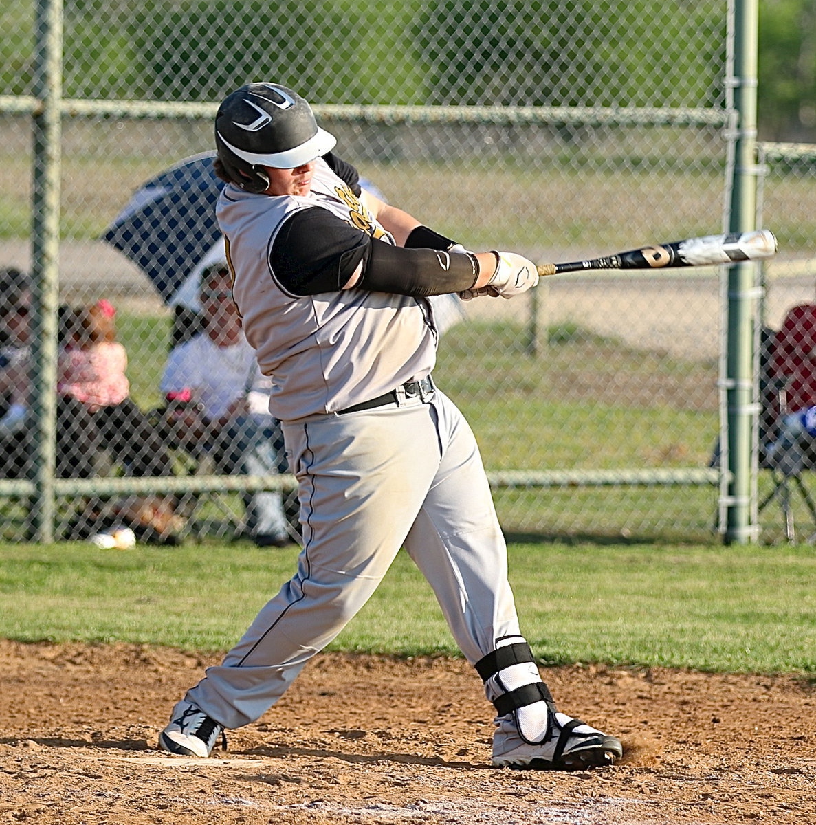 Image: John Byers(21) brings in a couple of runners with his mighty swing.