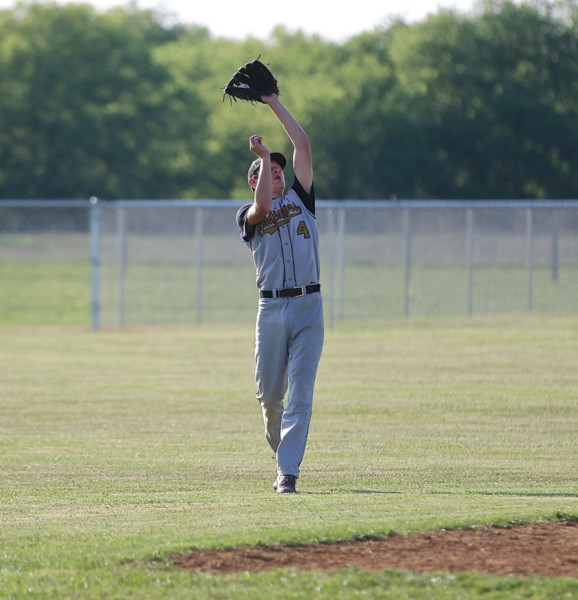 Image: Shortsop Ryan Connor(4) secures a popup for an Italy out.