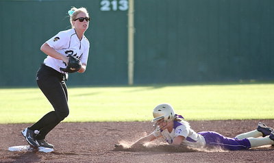 Image: Shortstop Madison Washington(2) makes the grab for the force out at second-base.