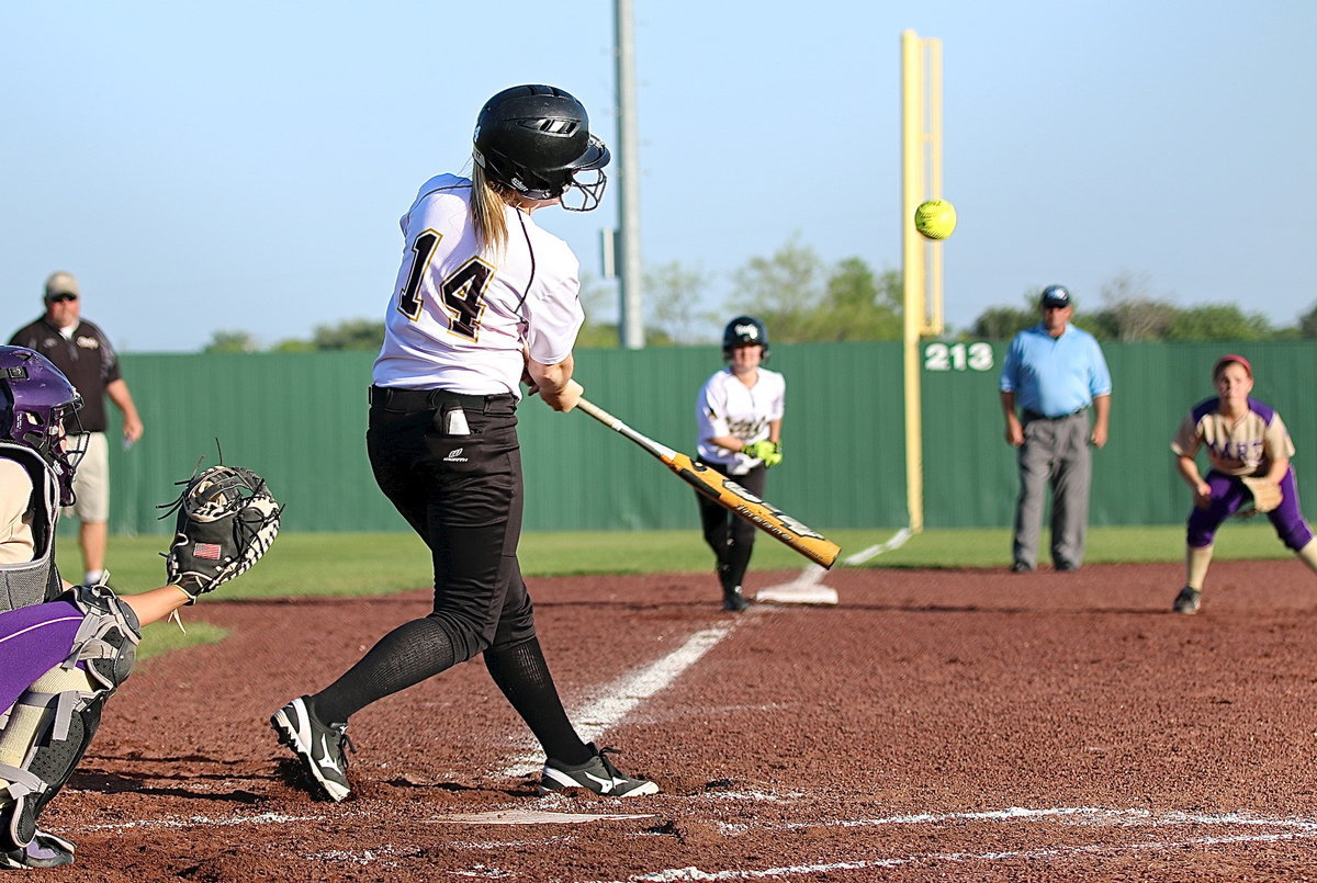 Image: Italy’s Kelsey Neslon(14) brings teammate Tara Wallis(5) in from third-base. Nelson recorded 3 RBIs and a double on the play.