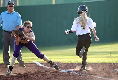 Image: Britney Chambers(4) is safe at first with Mart’s first-baseman not having her foot on the bag.