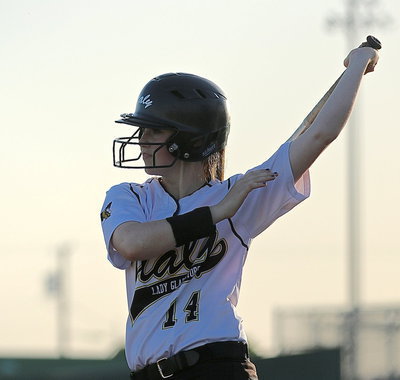 Image: Lady Gladiator Kelsey Nelson(14) takes a practice swing before stepping up to the plate.