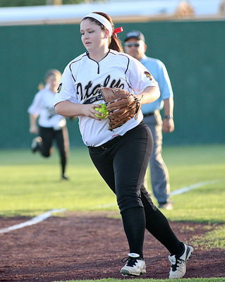 Image: Lady Gladiator first-baseman Paige Westbrook(10) collects a pop-up in foul territory for an out.